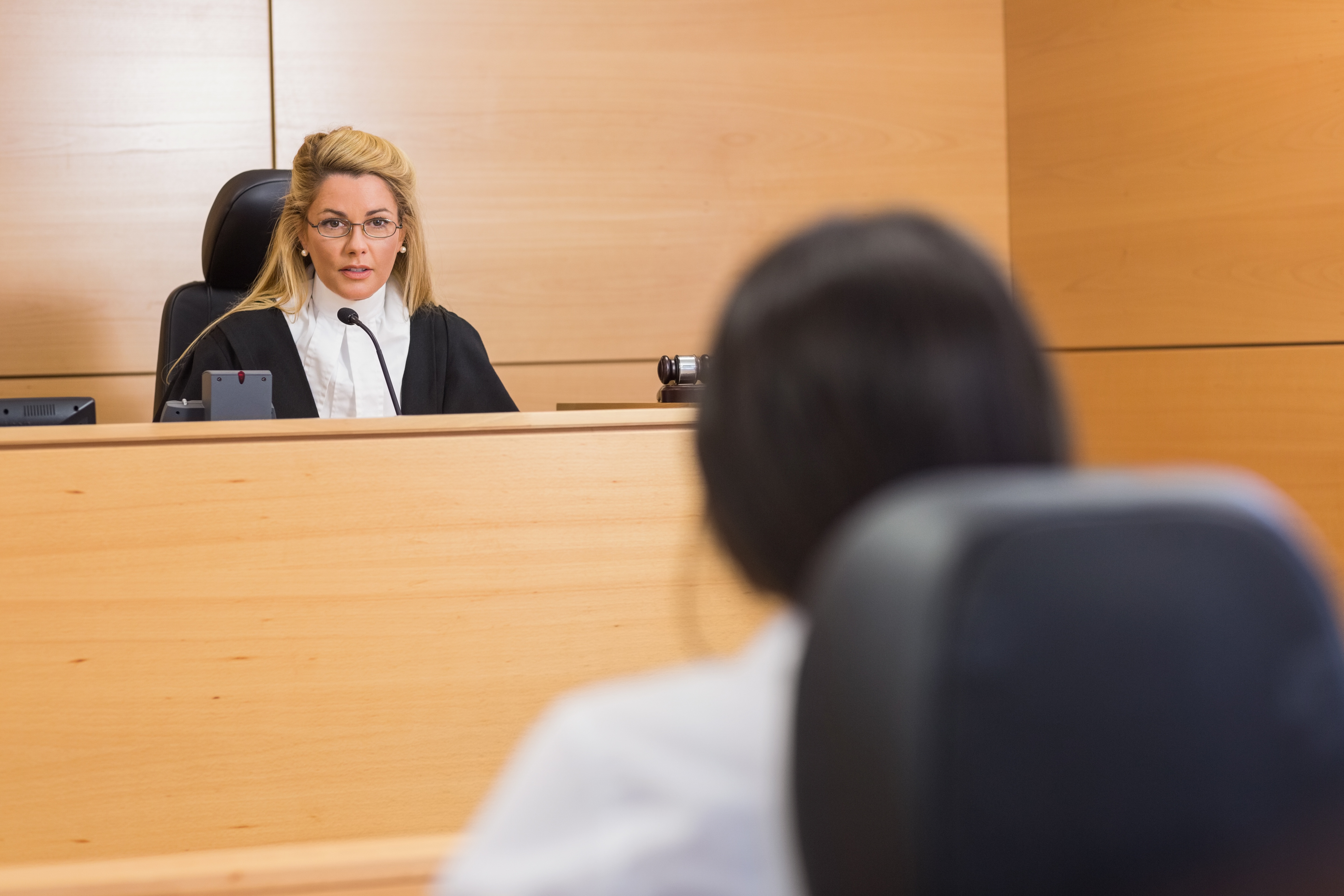 Sitting judge in a courtroom