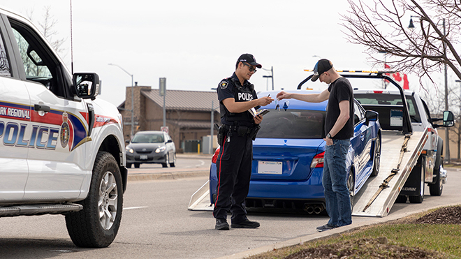 Image of Police officer pulling over speeding driver