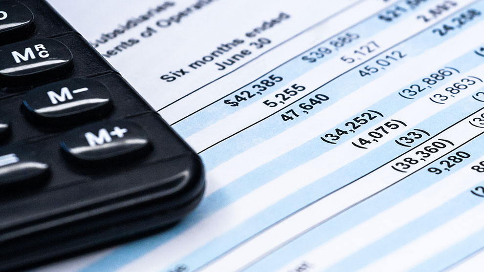 financial statement document and calculator