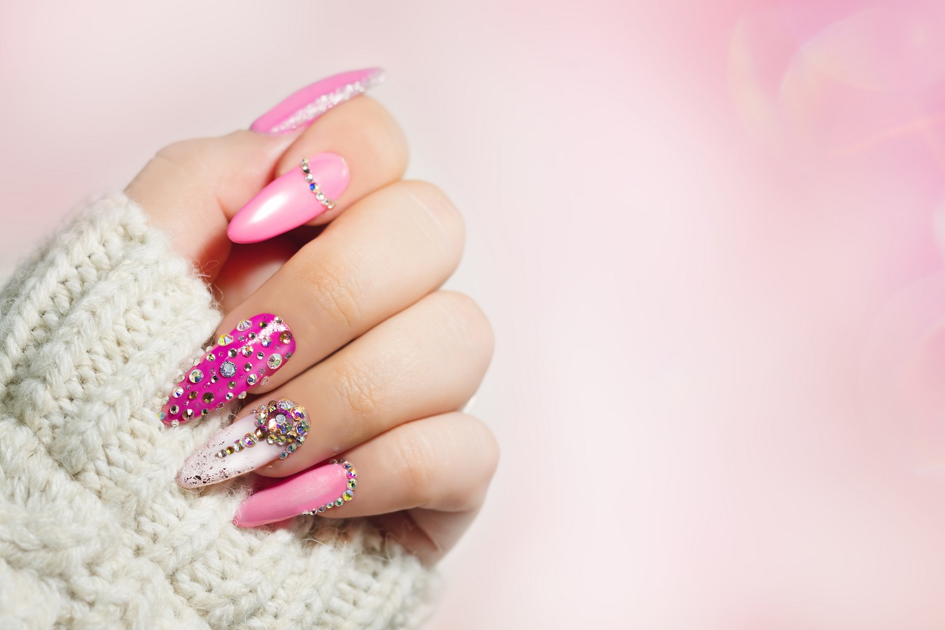 hand showing pink manicured nails