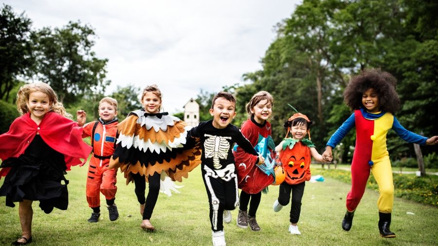 a diverse group of children in costume