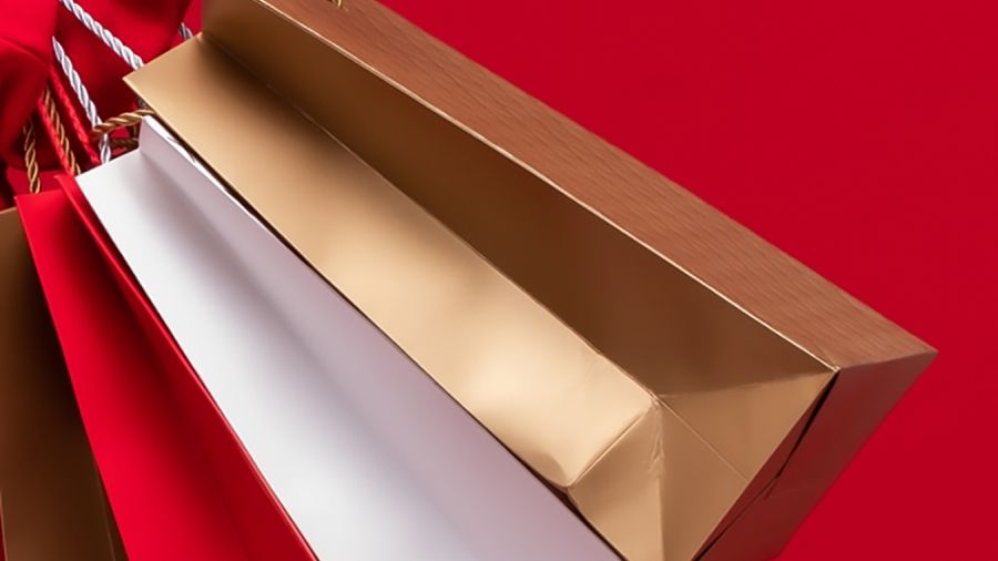 holiday shopping bags with a red background