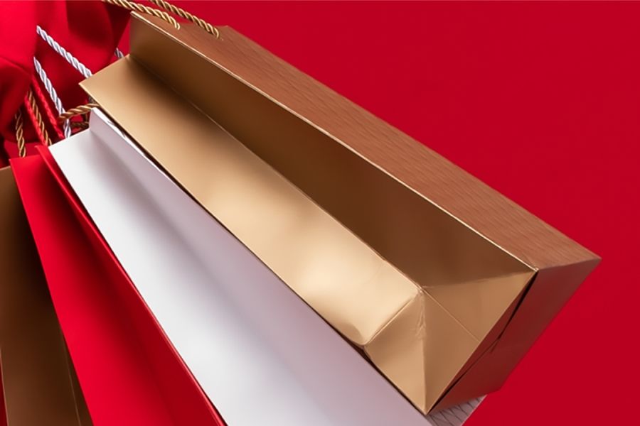 holiday shopping bags with a red background
