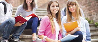 Students on steps outside of school