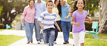 A multi-generational family is going for a walk together